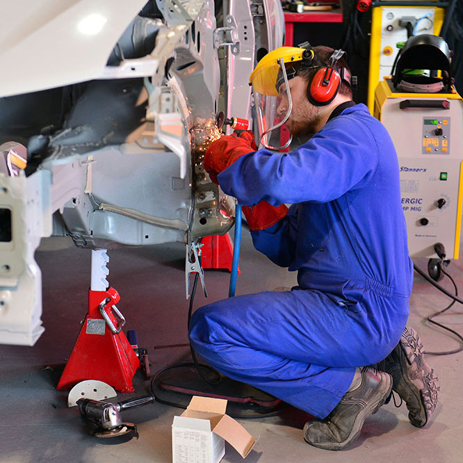 Apprentice mechanic Student fixing a car at Riverpark Training mechanic school, Northern Ireland