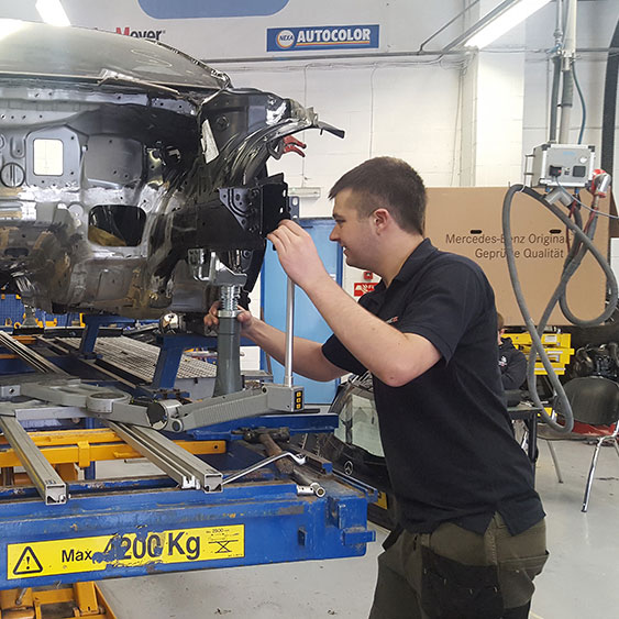 Student fitting motor components at Riverpark Training mechanic school, Northern Ireland